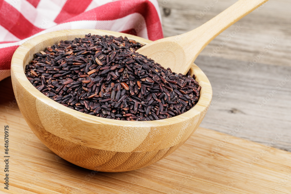 Wooden Bowl of delicious and healthy Black Rice Wooden Bowl of delicious and healthy Black Rice