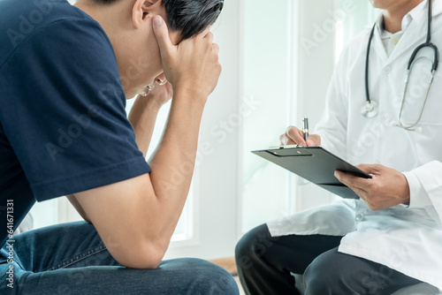 man with mental health problems is consulting. psychiatrist is recording the patient's condition for treatment. encouragement, love and family problem, bipolar , depression patient, protect suicide photo