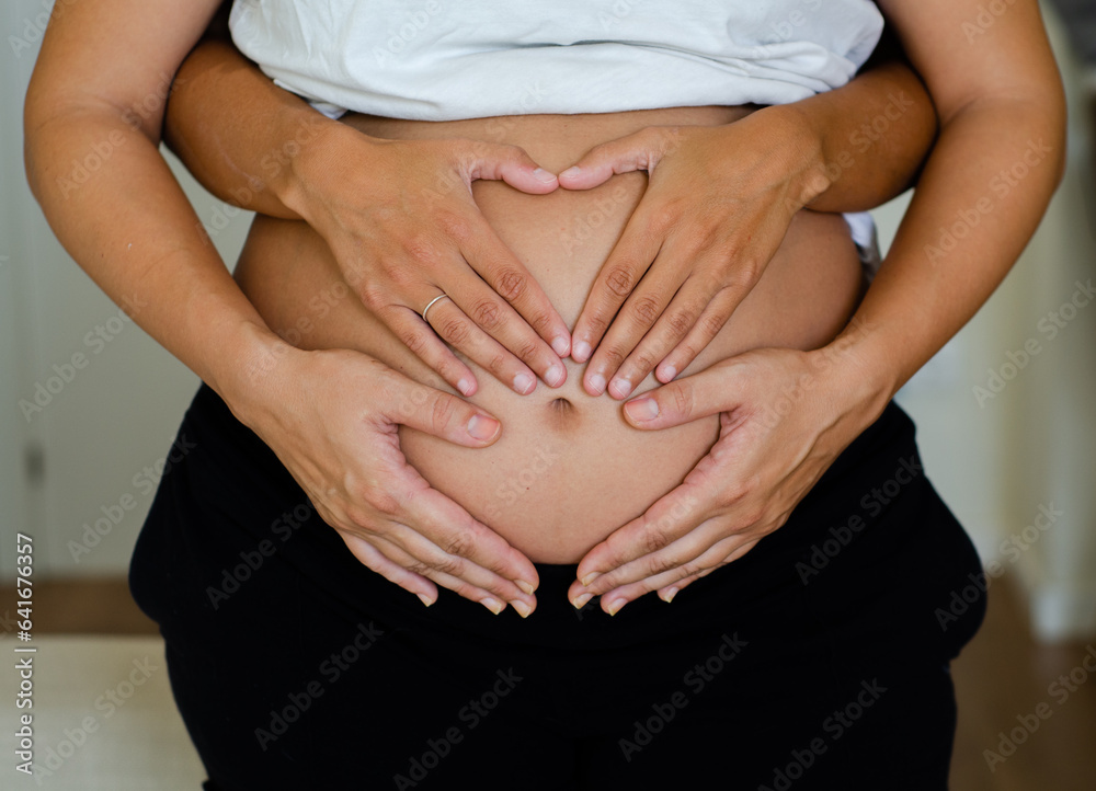 A young gay couple expecting a baby.
Two women waiting for their baby. Pregnancy and homosexual family concept A young gay couple expecting a baby.
Two women waiting for their baby. Pregnancy and homosexual family concept