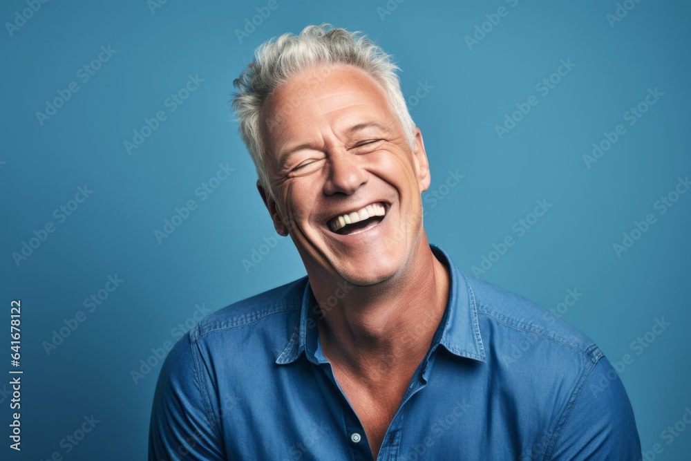 Lifestyle portrait photography of a happy mature man winking against a soft blue background. With generative AI technology