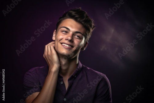 Medium shot portrait photography of a grinning boy in his 20s putting the hand on the forehead to look for someone in the distance against a deep purple background. With generative AI technology
