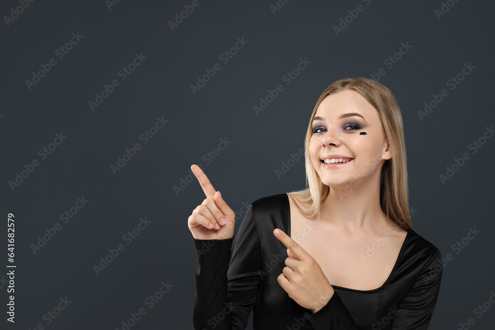 A girl with dark makeup for a Halloween party A girl with dark makeup for a Halloween party