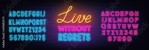 Live Without Regrets neon lettering on brick wall background.