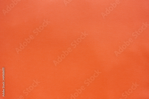 Orange brown artificial leather texture background, close up shot and free space for text present © Prapat