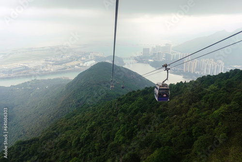 View from Nhong Ping 360 cable car crossing over the mountain in Tung Chung and Lantau Island photo
