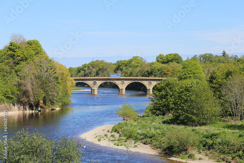 A bright sunny view in spring across the River Tweed from Scotland towards England.