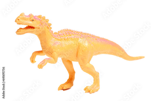 Yellow dinosaur toy isolated on white background.