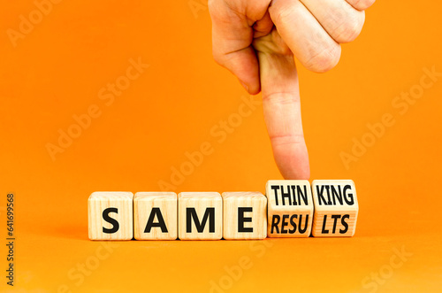 Same thinking and result symbol. Concept words Same thinking same results on wooden cubes. Beautiful orange background. Businessman hand. Business same thinking and result concept. Copy space.