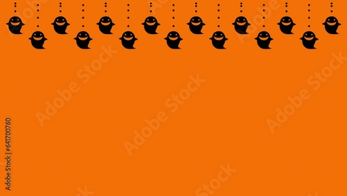ハロウィン　吊り下げゴースト　黒　背景　オレンジ