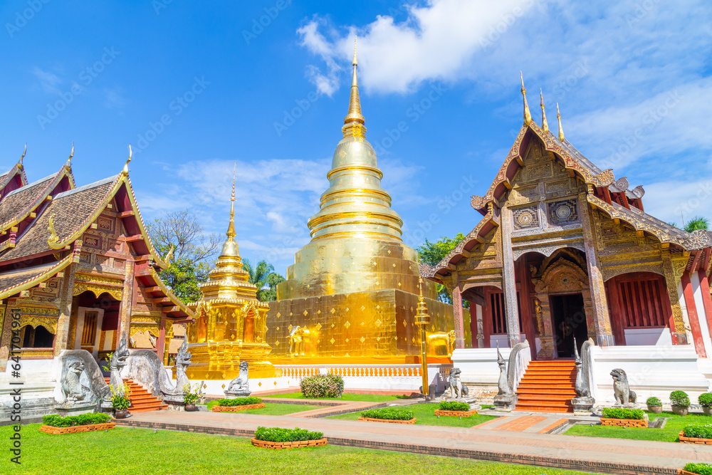 Fototapeta premium The Chapel and golden pagoda at Wat Phra Singh Woramahawihan in Chiang Mai, North of Thailand