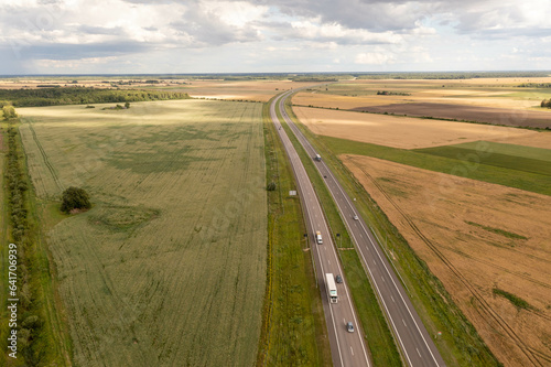 Drone photography of highway surrounded by agriculture fields