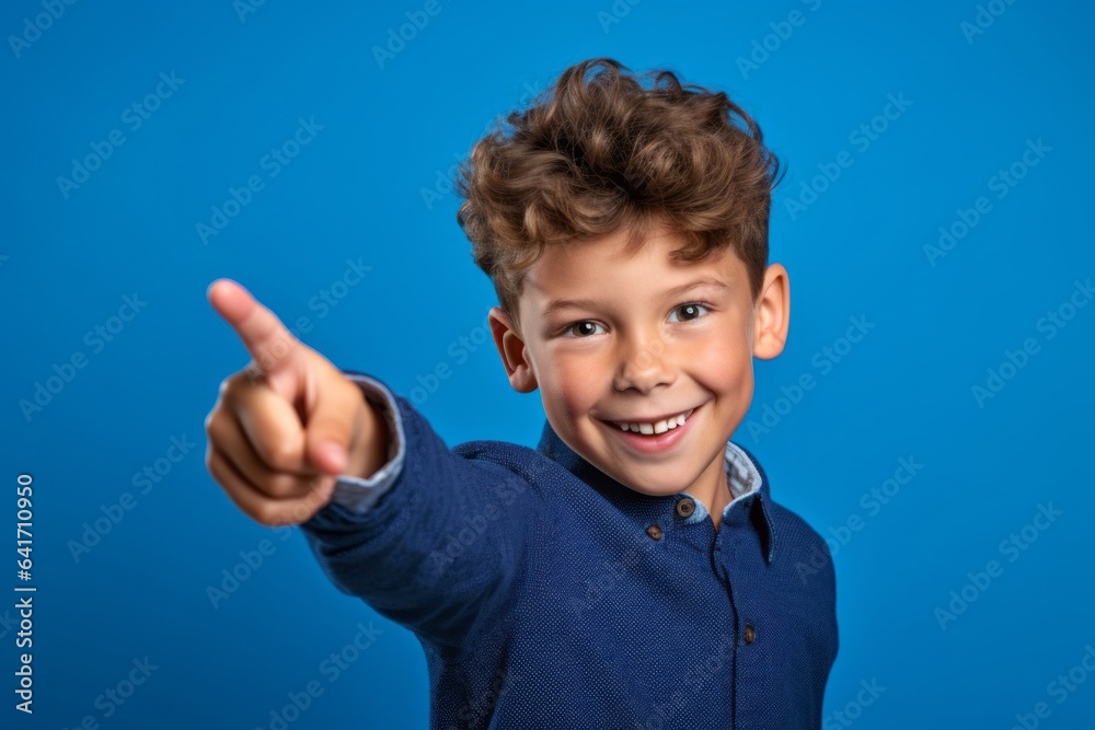 Medium shot portrait photography of a joyful kid male pointing with two hands and fingers to the side against a periwinkle blue background. With generative AI technology Medium shot portrait photography of a joyful kid male pointing with two hands and fingers to the side against a periwinkle blue background. With generative AI technology