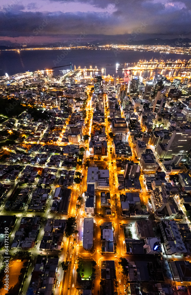 Naklejka premium Aerial view of Cape Town city centre at night in Western Cape, South Africa