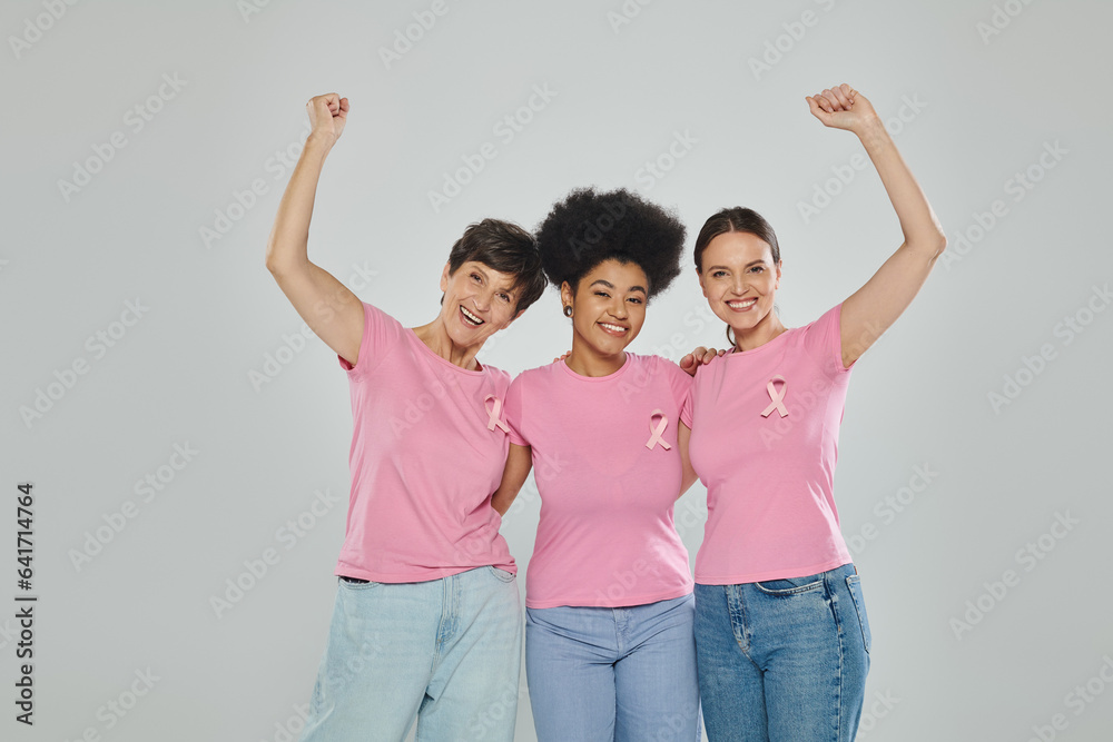 breast cancer awareness, excited interracial women on grey backdrop, different generations, portrait breast cancer awareness, excited interracial women on grey backdrop, different generations, portrait