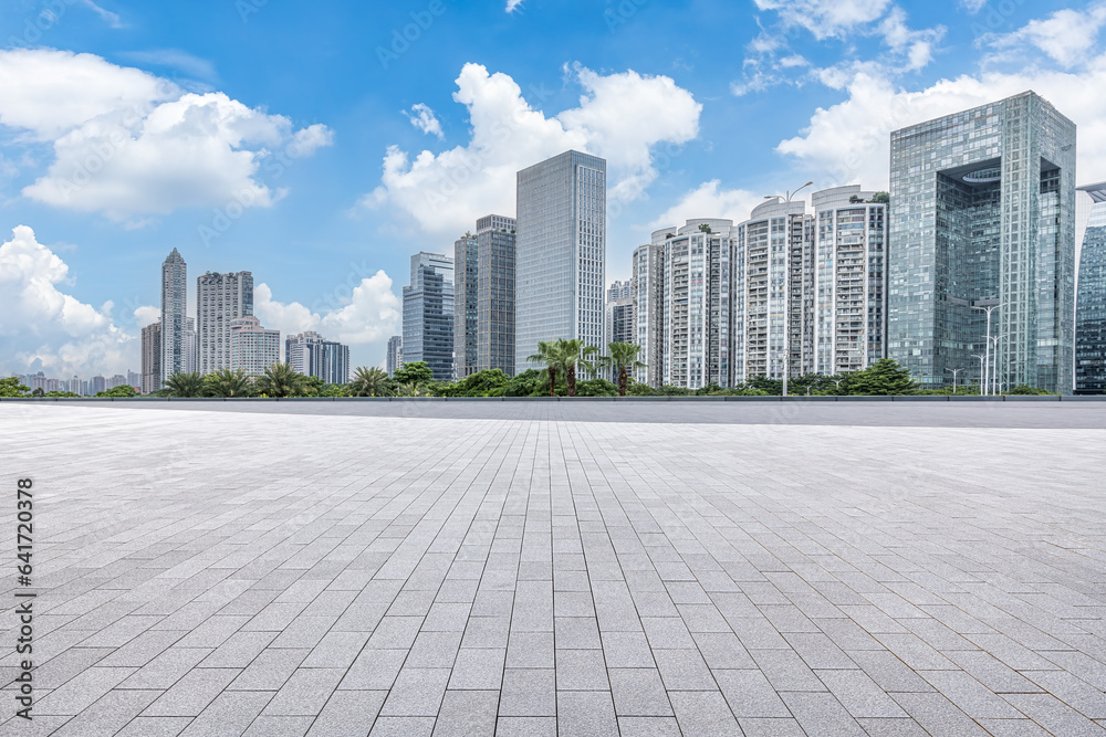 Empty square floor and city skyscrapers landscape in Guangdong, China Empty square floor and city skyscrapers landscape in Guangdong, China