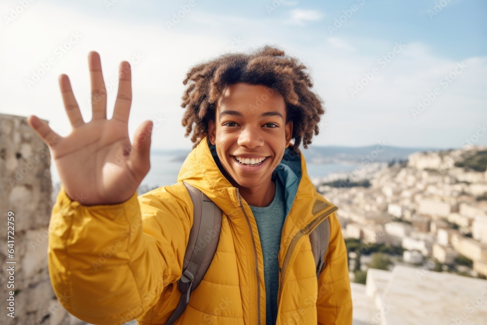 Medium shot portrait photography of a joyful boy in his 30s waving hello wearing a lightweight packable anorak at the acropolis in athens greece. With generative AI technology Medium shot portrait photography of a joyful boy in his 30s waving hello wearing a lightweight packable anorak at the acropolis in athens greece. With generative AI technology