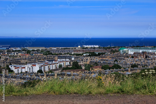 The high angle view of Edinburgh landscape from the mountain where near the National Monument of Scotland, England, UK. Cityscape of Edinburgh. Travel and nature scene.