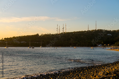 sunset view on senggigi beach lombok, beach and mountain landscape, sunset on the sea, waves on the sea, sea and sky, sunset on the beach, beach in summer photo