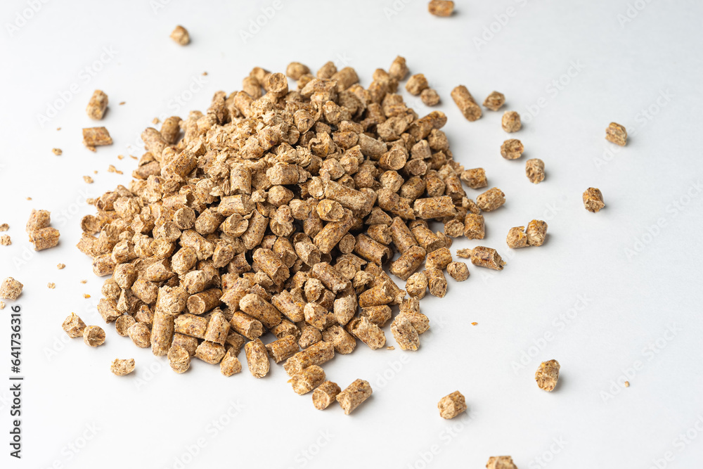 Wood pellets isolated on white background. Biofuels. Cat litter. Wood pellets isolated on white background. Biofuels. Cat litter.
