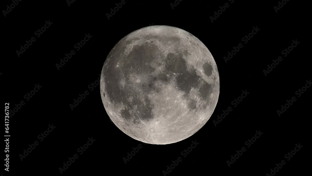 Blue moon August 2023 moving slowly across the night sky Blue moon August 2023 moving slowly across the night sky