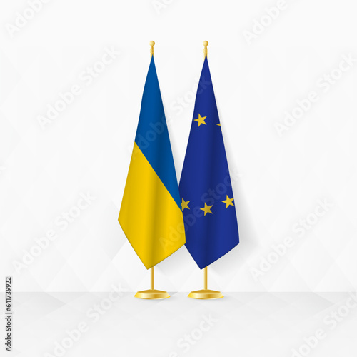 Ukraine and European Union flags on flag stand, illustration for diplomacy and other meeting between Ukraine and European Union.