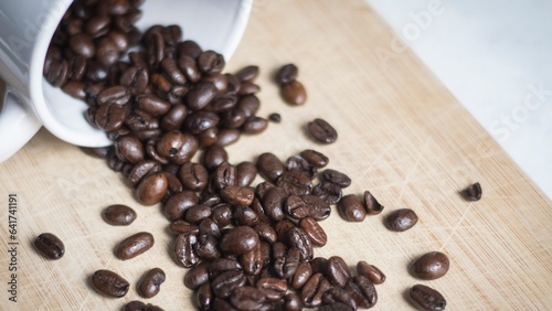 Coffee beans with spoon and glass ready to be served