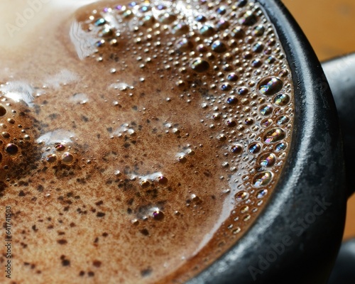Coffee beans with spoon and glass ready to be served