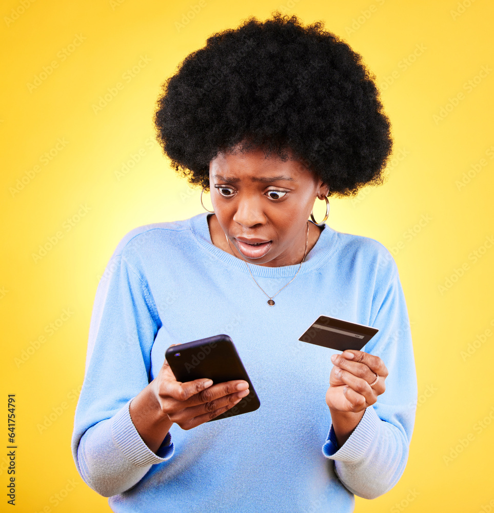 Surprised, credit card and woman with phone scam and shock from problem and tech in studio. Stress, mobile and confused from phishing, hacking and ecommerce spam with anxiety and yellow background Surprised, credit card and woman with phone scam and shock from problem and tech in studio. Stress, mobile and confused from phishing, hacking and ecommerce spam with anxiety and yellow background