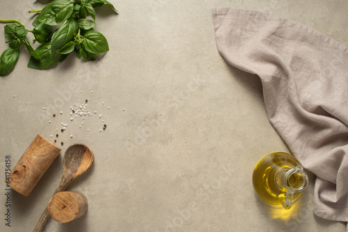Culinary gray background with utensils, spices and towel. Cooking