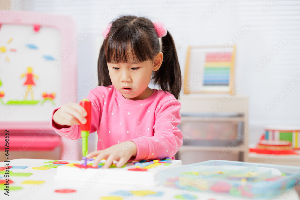 young girl was playing creative toys at home young girl was playing creative toys at home