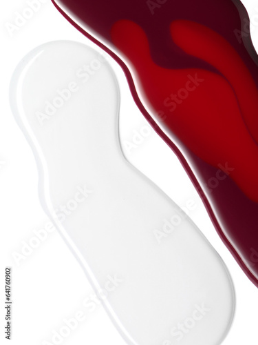 Red nail polish and clear base coat composition shapes of texture isolated on white background. Cosmetic makeup product texture photo