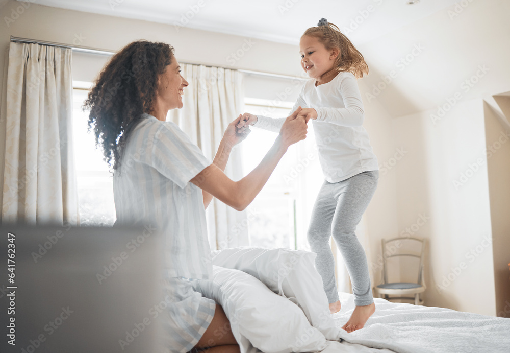 Bed, mother and girl in a home, jump and family with love, weekend break and playing together. Parent, kid and child in a bedroom, fun and happiness with activity, morning and cheerful with energy
