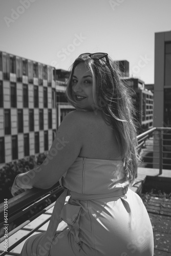 Sunny Rooftop Day: Fashionable Curvy Model in Sunglasses Portrait B&W