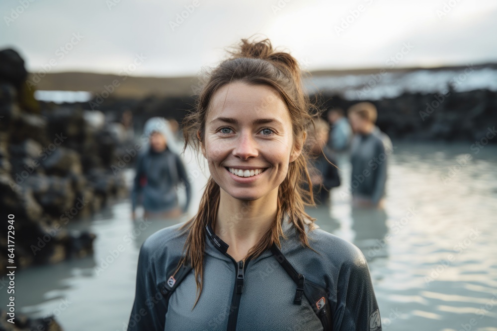 Environmental portrait photography of a grinning girl in her 30s wearing a lightweight base layer at the blue lagoon in reykjavik iceland. With generative AI technology - obrazy, fototapety, plakaty 