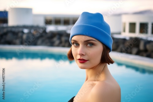 Medium shot portrait photography of a merry girl in his 30s wearing a sophisticated pillbox hat at the blue lagoon in reykjavik iceland. With generative AI technology © Markus Schröder