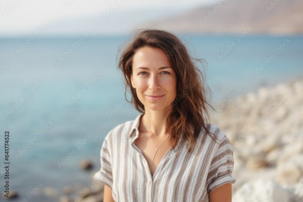 Headshot portrait photography of a content girl in her 40s wearing a trendy off-shoulder blouse at the dead sea in israel/jordan. With generative AI technology Headshot portrait photography of a content girl in her 40s wearing a trendy off-shoulder blouse at the dead sea in israel/jordan. With generative AI technology