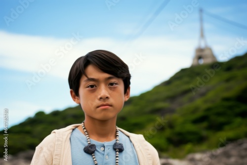 Environmental portrait photography of a merry boy in his 30s wearing a chic pearl necklace at the aogashima volcano in tokyo japan. With generative AI technology photo