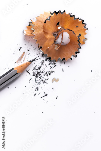Portrait mode shot of beautiful pencil shaving shot over white background for Learning concept.