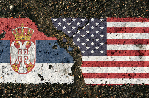 On the pavement are images of the flags of Serbia and the United States, as a symbol of confrontation.