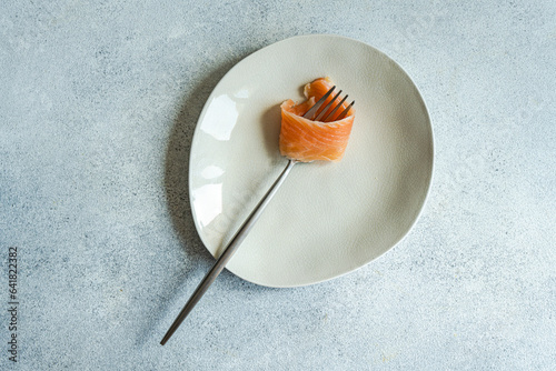 Healthy salmon slice on white plate