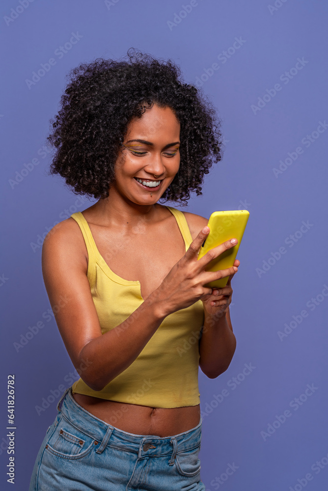Happy ethnic woman using cellphone Happy ethnic woman using cellphone