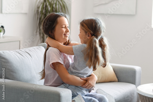 Cute little sisters hugging...