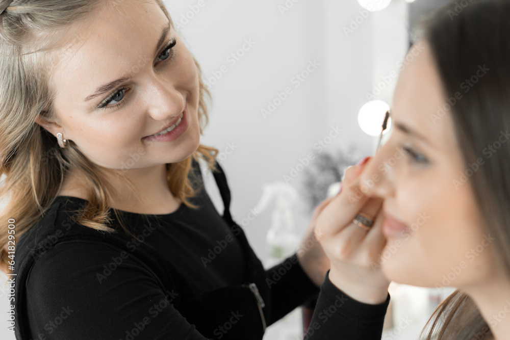 In this photofragment, we see the moment of embodiment creative ideas makeup artist who professionally corrects shape and line eyebrows. Makeup artist focuses on creating natural and expressive image In this photofragment, we see the moment of embodiment creative ideas makeup artist who professionally corrects shape and line eyebrows. Makeup artist focuses on creating natural and expressive image