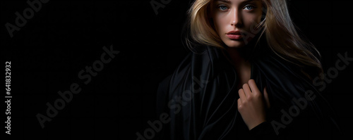 Fashion Portrait on a Dark Background.  Beautiful Woman Posing on Black © EwaStudio