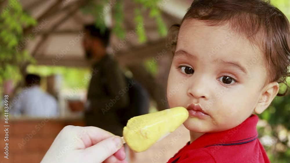 cute toddler eating kulfi the authentic indian local ice cream at outdoor cute toddler eating kulfi the authentic indian local ice cream at outdoor