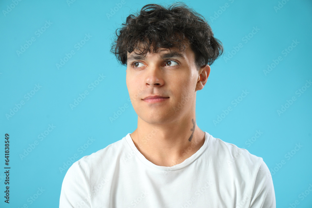 Portrait of handsome young man on blue background Portrait of handsome young man on blue background