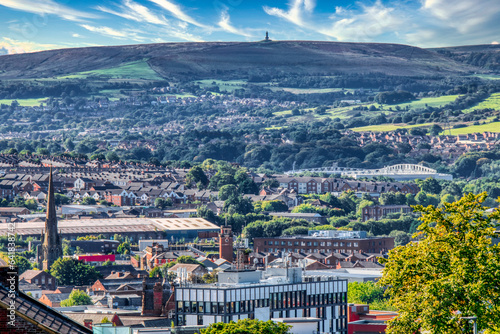 Blackburn Town with Darwen Moors in the distance photo