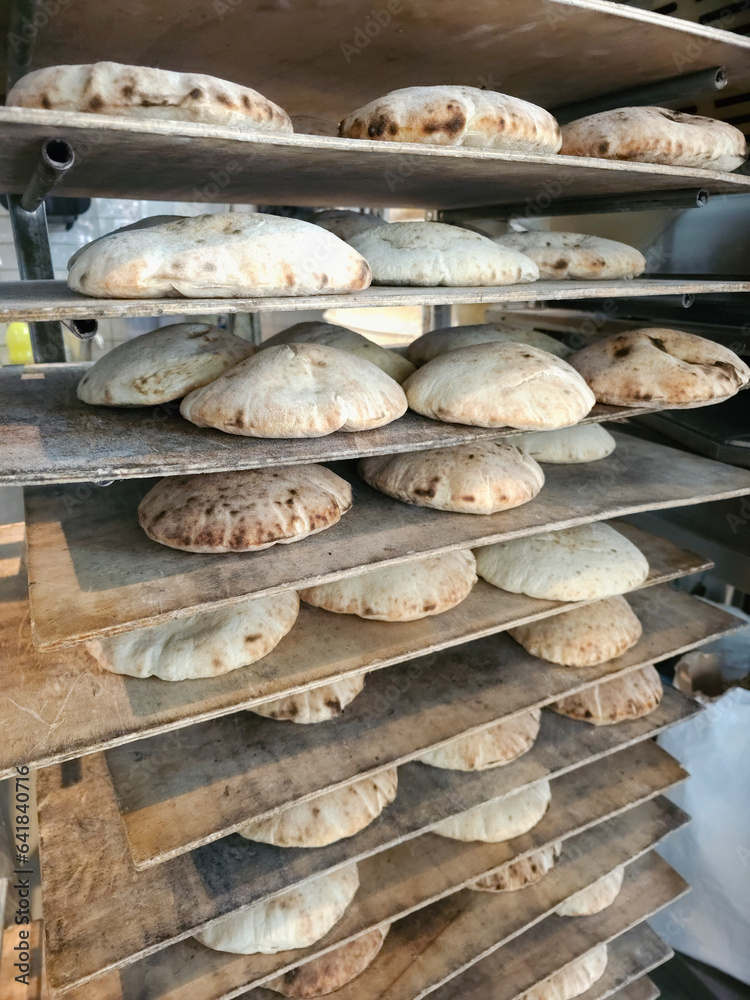 Freshly baked breads in the kitchen of a restaurant with Middle Eastern food, Vienna, Austria.