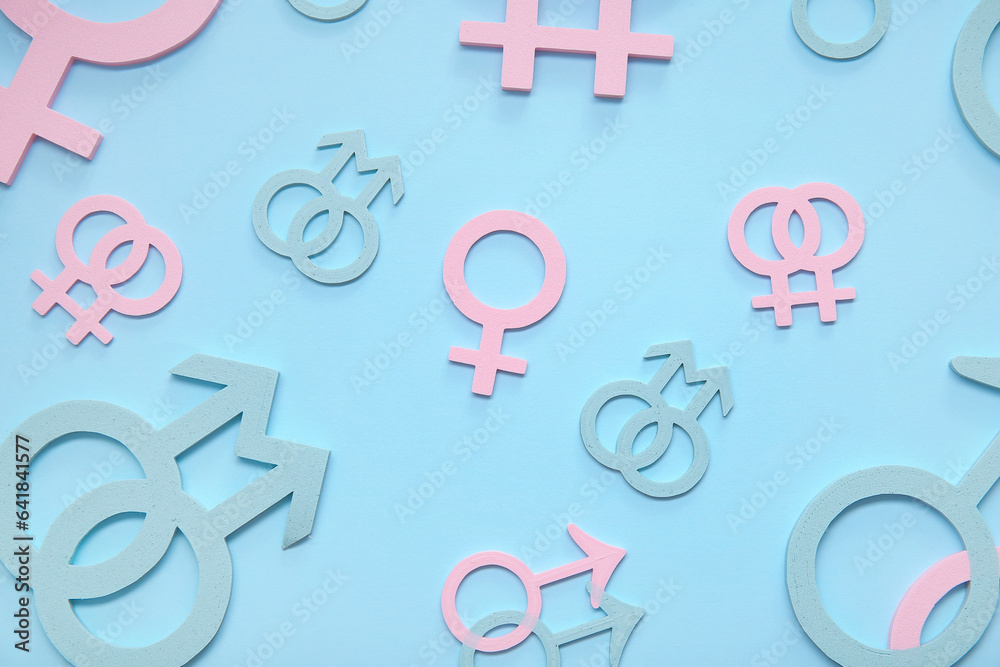 Female, male and homosexual symbols on blue background. LGBT concept Female, male and homosexual symbols on blue background. LGBT concept