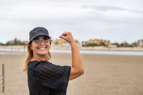 Joyful tourist on summer vacations on the beach